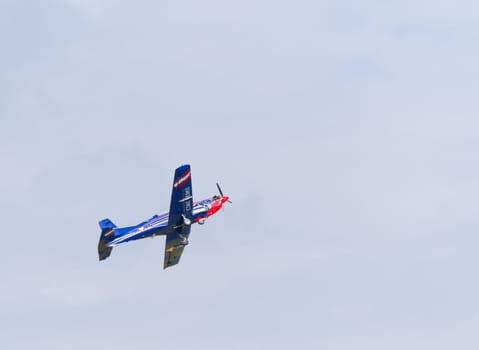 LEEUWARDEN, NETHERLANDS - JUNE 6, 2016: PC-7 Pilatus propeller plane performing a demonstration flight during the Dutch Air Force open days.