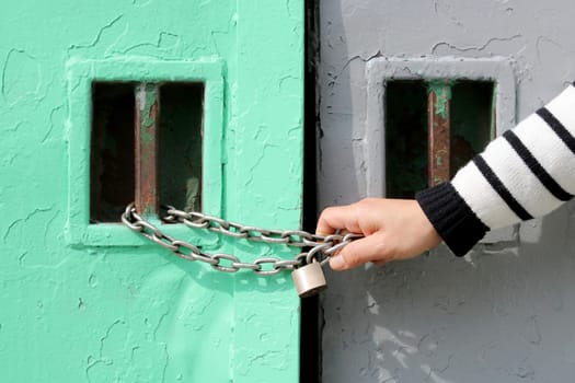Old metal door with chain key lock
