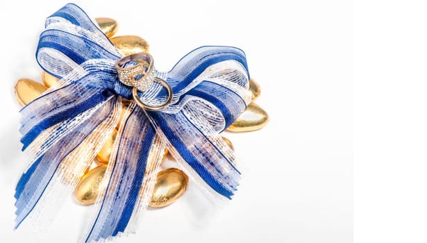 a isolated  wedding rings and satin bow