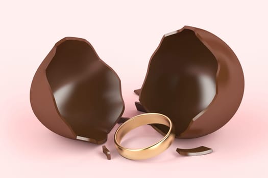 Broken chocolate egg with a surprise, golden engagement ring inside