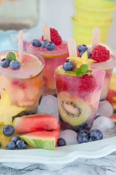 Homemade popsicles with colorful fruits