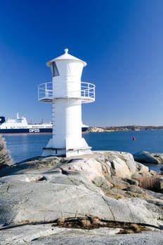 one lighthouse on sweden west-coast standing on a cliff