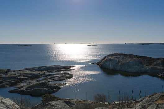 the sun is going down on the swedish west-coast outside Gothenburg in early spring