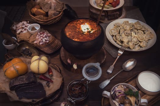 Russian food: borsch pickles cheese meat dumplings and fat