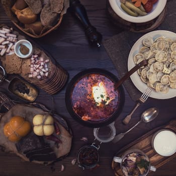 Russian food: borsch pickles cheese meat dumplings and fat