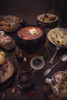 Russian food: borsch pickles cheese meat dumplings and fat