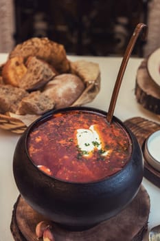 Russian borsch at pot on the table