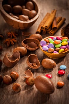 Assorted chocolate eggs for Easter on wooden background