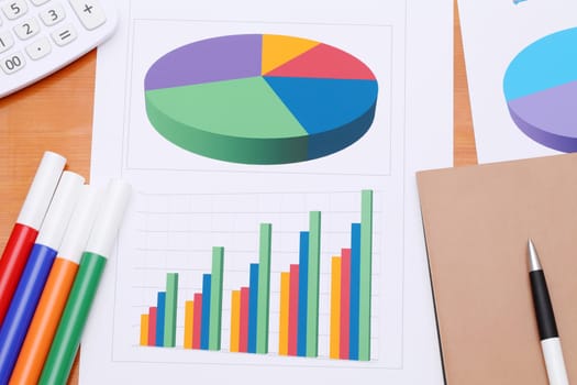Color chart printed documents with pen and notebook