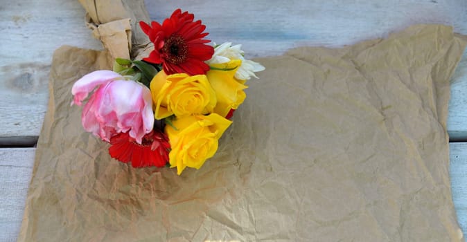 colourful bouquet of flowers on an old wooden background