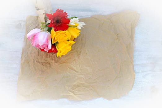 colourful bouquet of flowers on an old wooden background