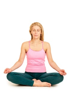 Frontal full-body view of a young woman against a white background in the lotus position (Padmasana).