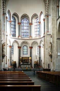 Cologne,Germany - November 24,2016: The interior of St. Kunibert Church with the altar,religious relics and a triptych on November 24,2016 in Cologne.