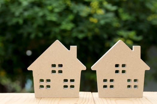 wooden toy house with green natural background