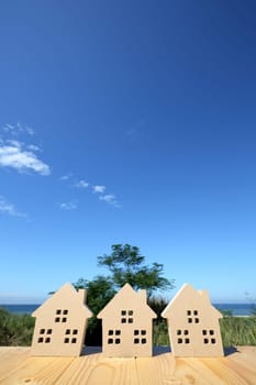 Miniature model of house with blue sky background