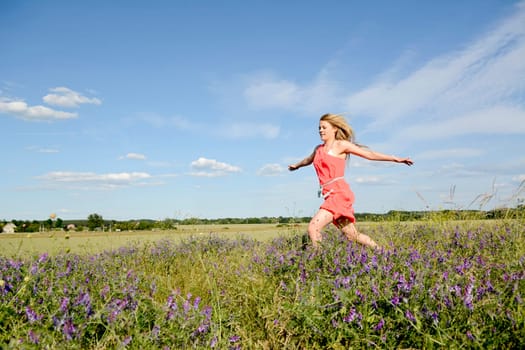 young woman on flower meadow
