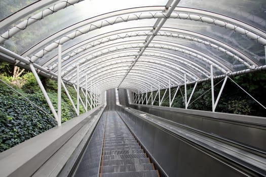 Outdoor escalator and stair with roof, close up