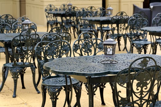 chairs and table with old lantern