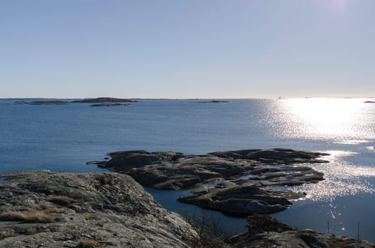 the sun is going down on the swedish west-coast outside Gothenburg in early spring