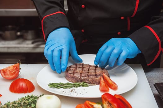 Chef set grilled meat steak on the plate