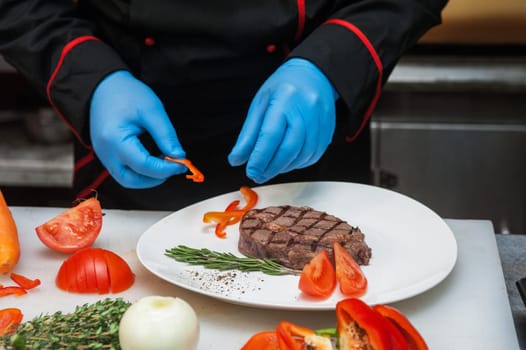 Chef set grilled meat steak on the plate