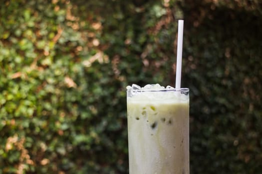 Matcha Tea With Milk On Garden Table, stock photo