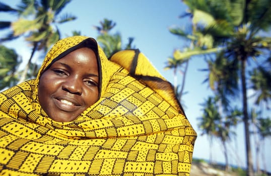 A woman in the village of Bwejuu on the dream beach of Bwejuu on the eastern coast of the island of Zanzibar,which is part of Tanzania.