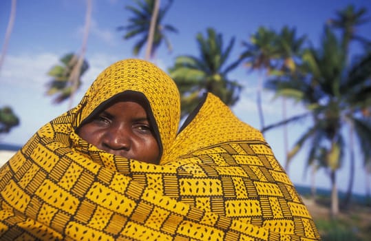A woman in the village of Bwejuu on the dream beach of Bwejuu on the eastern coast of the island of Zanzibar,which is part of Tanzania.
