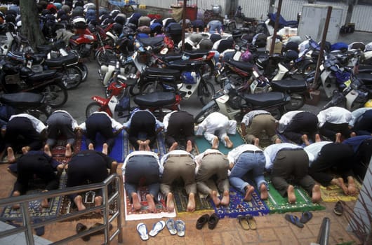 Muslim prayers at a Mosque in the city of  Kuala Lumpur in Malaysia in southeastasia.