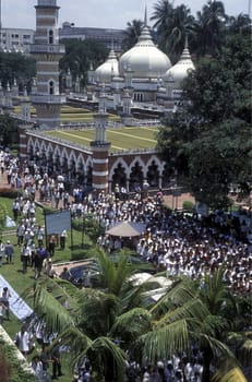 Muslim prayers at a Mosque in the city of  Kuala Lumpur in Malaysia in southeastasia.