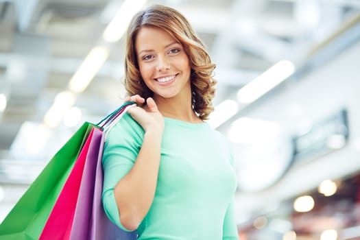Cute shopaholic with shopping bags