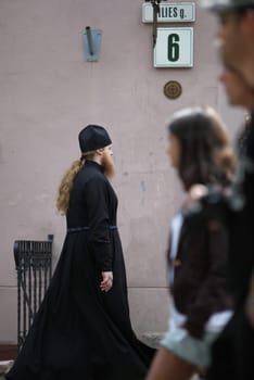 a Monk in the old City of Vilnius in the Baltic State of Lithuania