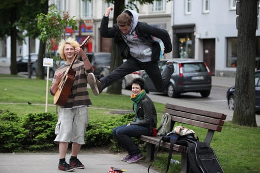 Kids play music and dance in the City Vilnius with the Cityhall  in the Baltic State of Lithuania