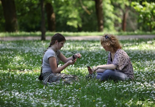 People in a Parc in the old City of Vilnius in the Baltic State of Lithuania