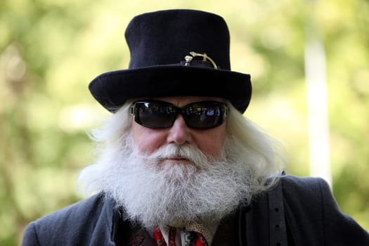 a men in traditional dress on a Summer Festival in a Parc in the old City of Vilnius in the Baltic State of Lithuania