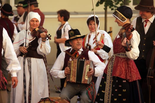 A traditional dance group attends a breakfast party in the Old Town of Vilnius,the capital of Lithuania in the Baltics in Eastern Europe.