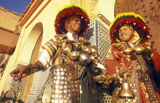 Traditional water seller at the Djemma del Fna Square in the old town of Marrakesh in Morocco in North Africa..