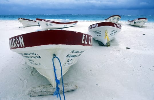 The beach with boat from Tulum on the Caribbean Sea in the state of Quintana Roo on the Yuctan Peninsula in the south of Mexico in Central America.