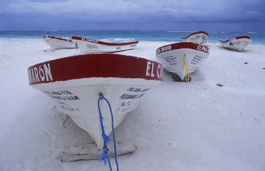 The beach with boat from Tulum on the Caribbean Sea in the state of Quintana Roo on the Yuctan Peninsula in the south of Mexico in Central America.