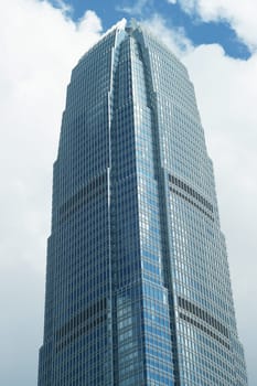 A single very tall high rise building in Hong Kong with only windows showing..