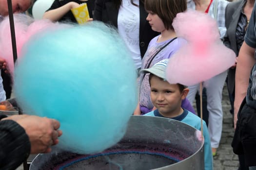 People at a candy candy stand at a party in the centre of Poznan in western Poland.