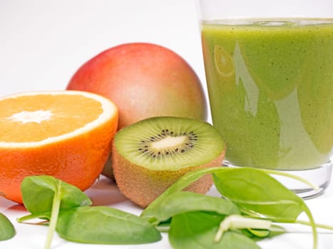 green smoothie with spinach leaves,kiwi and orange