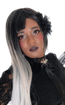 A closeup image of a beautiful African American woman from front in a .black lace dress standing isolated for white background..