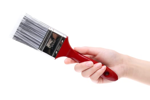 Hand holding new paint brush isolated on white background