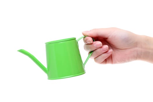 Hand holding watering can isolated on white background