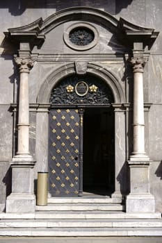 Mainz,Germany - March 24,2017: The entrance door of the Museum im Kurfürstlichen Schloss Mainz,shod with gold,ornaments and coats of arms,on March 24,2017 in Mainz.