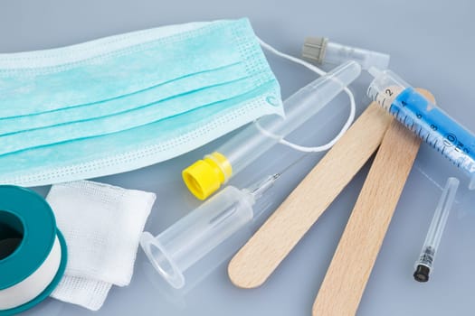 Syringes and needles and other medical items. Healthcare or pharmacy themes.