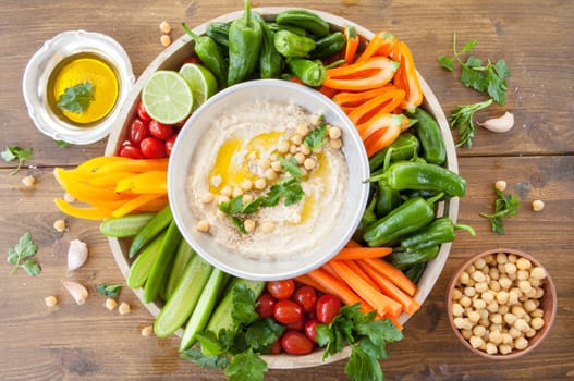Homemade hummus and fresh vegetables for dipping