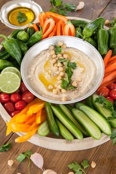 Homemade hummus and fresh vegetables for dipping