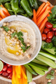 Homemade hummus and fresh vegetables for dipping
